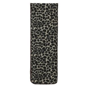 Close-up of leopard print knit scarf showing refined stitching and warm fabric texture