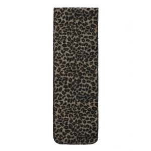 Detailed view of leopard print scarf with fine stitching and soft texture for winter