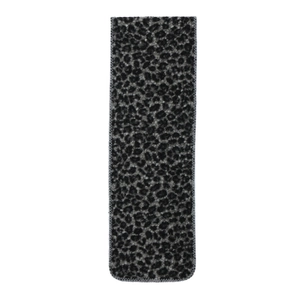Macro detail of thick leopard print scarf with black grey patterns and overlocked edges