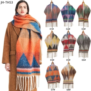 Thick knit winter scarf with triangle jacquard pattern and fringes in various colors