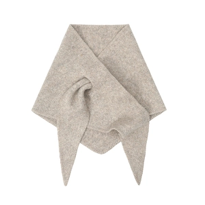 Detail of oatmeal knit triangular shawl showing high-quality wool texture and stitching