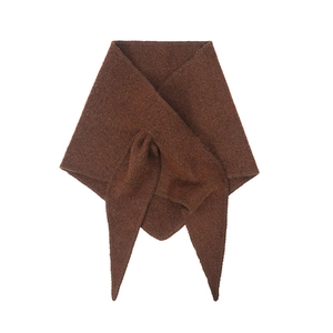 Close-up of the fine knit texture and soft wool blend fabric on this dark brown shawl