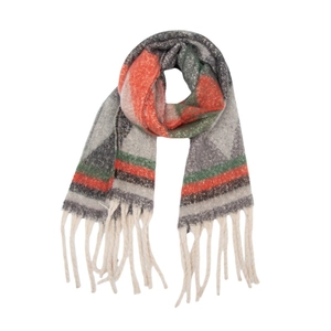 Detail of winter scarf showing thick boucle yarn texture and soft tassel fringe
