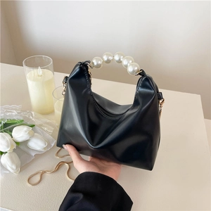 Elegant black pearl handle mini handbag with gold chain and soft faux leather finish
