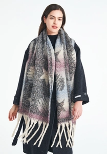 Detail of winter star pattern scarf with long tassels and thick mohair texture fabric