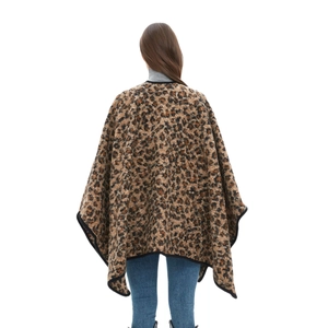 Women's leopard print knit poncho with thick jacquard fabric and black trim edges