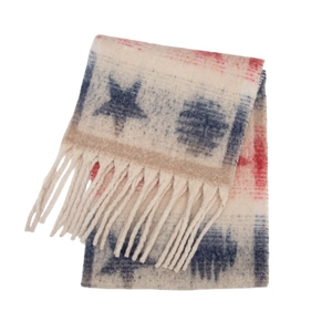 Close-up of thick tassel trim and plush star pattern jacquard on winter shawl scarf