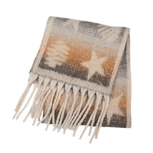 Detailed view of the thick fringe and soft star patterned winter knit scarf fabric