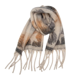 Detailed texture of thick knit star pattern scarf with long fringe tassels in cream and grey