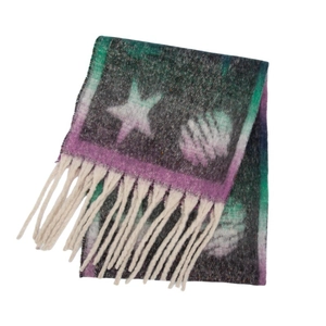 Detail of thick white tassels and abstract star pattern on a fuzzy pashmina scarf