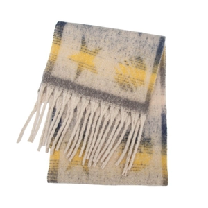 Detail of chunky knit star scarf with long fringe tassels in beige and grey