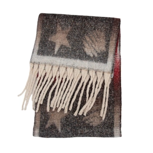 Close-up of thick winter scarf with vintage star patterns and long cream tassels