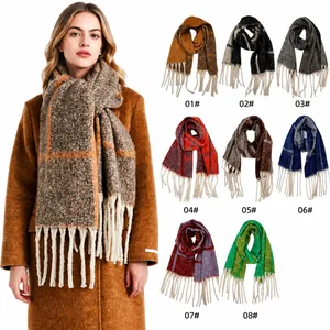 Close-up of thick plaid boucle scarf with tassel details in eight various color options