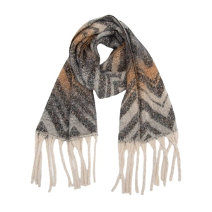 Close-up of thick mountain-patterned knit scarf with long cream tassels at the edge
