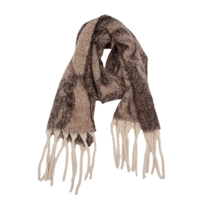 Detail of warm autumn winter knit shawl with jacquard chain patterns and long tassels