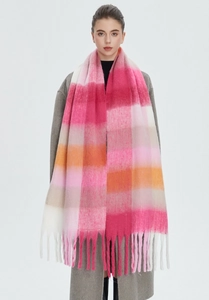 Detail of pink and orange rainbow plaid scarf with soft mohair texture and fringed edges