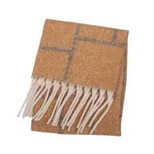 Macro detail of soft plaid scarf texture with warm orange tones and fringe tassels
