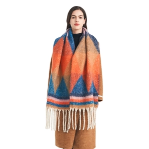 Thick colorful geometric patterned knit scarf with tassels for winter season wear