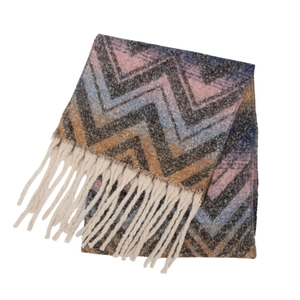 Close-up of zigzag mountain pattern on thick textured scarf with white tassel details
