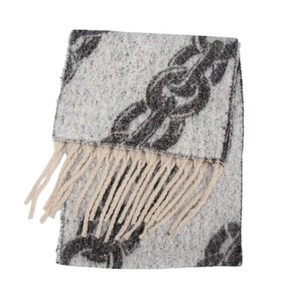 Detail view of winter women's shawl with chain print pattern and long fringe tassels