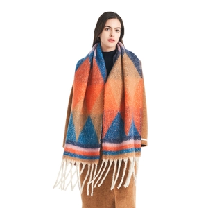 Thick knit scarf with colorful geometric patterns and long tassels for women