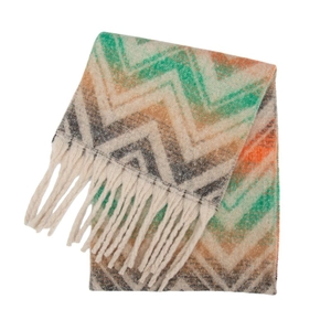 Close-up of thick bouclé knit scarf with mountain wave pattern and long fringes