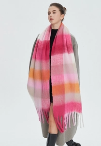Detailed close-up of rainbow plaid mohair scarf with soft texture and long fringe tassels