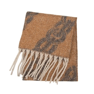 Detailed close-up of chain pattern knit scarf with fringe tassels and soft fuzzy texture