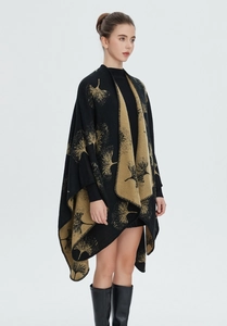 Detail of black and yellow ginkgo leaf jacquard knit shawl with fine edge stitching