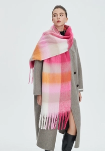 Detail shot of heavy rainbow check scarf with long tassels in pink orange and beige colors