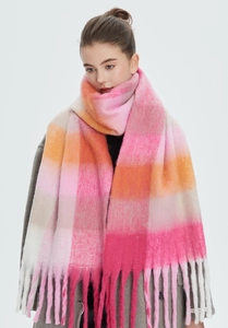 Detail of soft mohair-like rainbow plaid scarf with long fringes in warm macaron tones