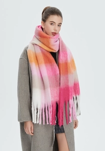 Close-up of thick rainbow plaid mohair scarf with pink and orange blocks and long tassels