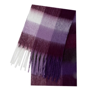 Detail of soft purple and white plaid scarf featuring thick mohair texture and fringe
