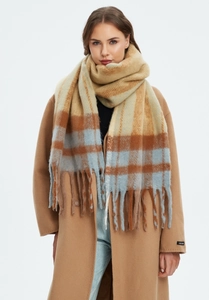 Detail of thick khaki plaid scarf with long tassels and plush faux mohair texture