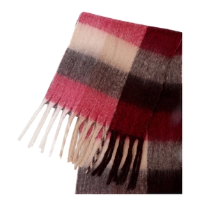 Detail of soft mohair texture and long tassels on a colorful plaid scarf