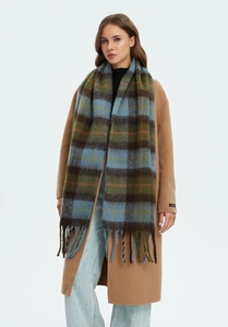 Detail of a thick plaid tassel scarf in blue, green and brown faux mohair fabric