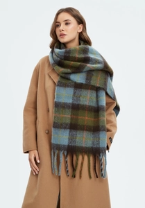 Detail of soft mohair-like plaid scarf featuring vintage blue and green check patterns