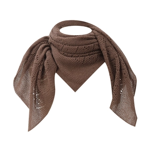Detailed macro view of dark brown knitted lace shawl with hollow-out geometric patterns