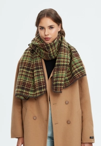 Detailed texture of thick green and brown plaid Christmas scarf on camel wool coat