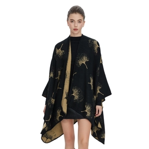 Women's black knit poncho shawl with golden ginkgo leaf pattern and open front