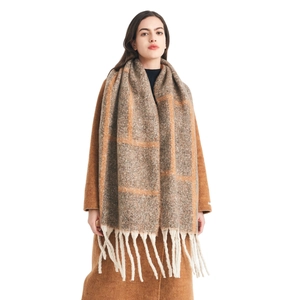 Thick winter plaid scarf with loop yarn texture and long tassels in earthy brown tones
