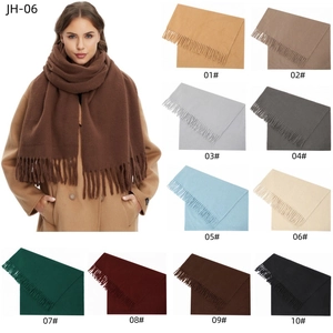 Detail of solid color winter scarves featuring soft fringe texture and 10 color options
