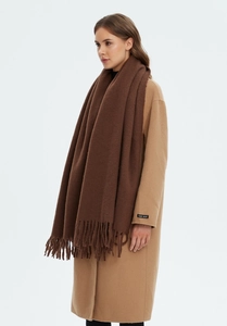 Detail of dark brown cashmere scarf texture with long fringe on a beige coat