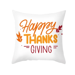 White Thanksgiving pillow cover featuring Happy THANKSGIVING text and orange maple leaves