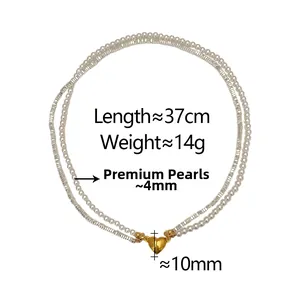 Detail of double-layer necklace with white pearls, silver beads and gold heart magnetic clasp