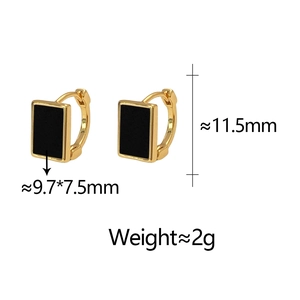 Detail view of gold rectangular hoop earrings with black enamel and dimensions