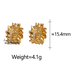 Detail view of irregular gold leaf earrings with zircon inlay and product dimensions