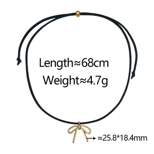 Detail of black cord necklace with gold bow pendant showing 68cm length and 4.7g weight