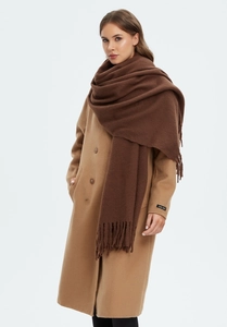 Detail of dark brown tassel scarf paired with camel wool coat and handmade label