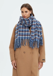 Detail of blue and brown checkered scarf with fringe on camel wool coat